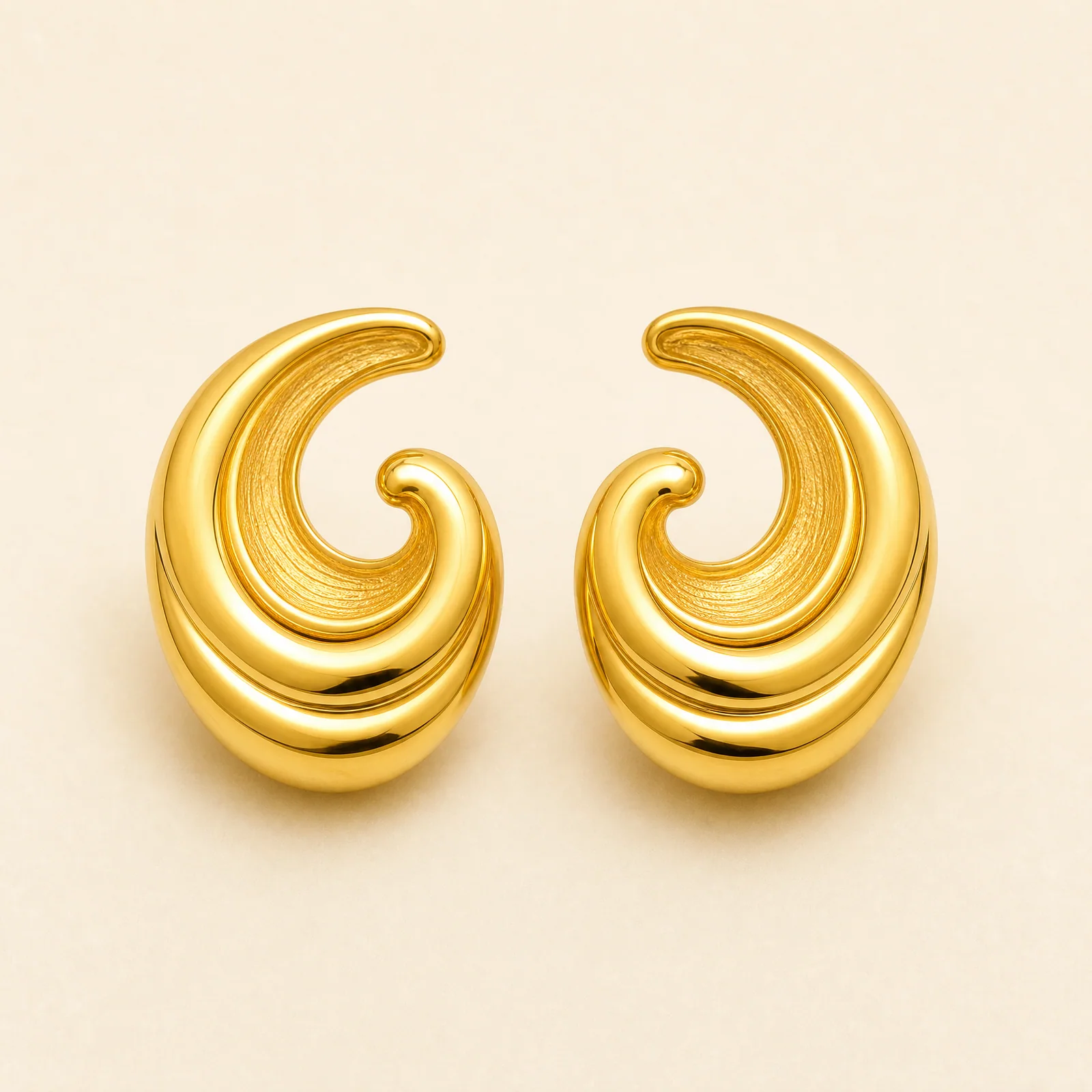 Crescent Spiral Shell Earrings — official catalogue photo